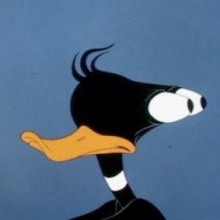 schwarze Comic-Ente mit Augen am Hinterkopf